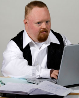 adult-man-with-downs-syndrome-working-studying.jpg